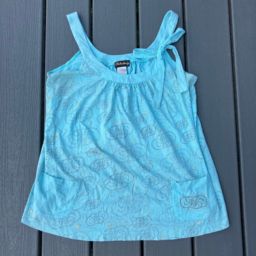 Blue tank top with swirl print and gold starbursts, bow tie, coquette cutecore